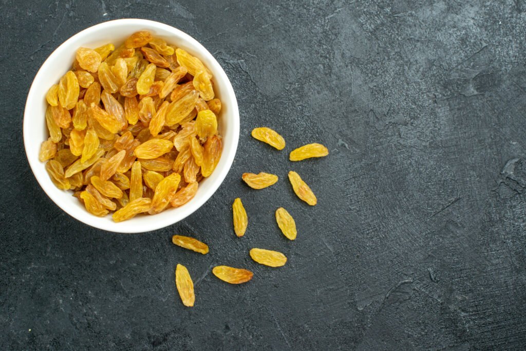 top view dried grape raisins inside plate dark surface raisins fruit dried sour